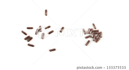 Iron capsule isolated, Fe pills, brown hemoglobin supplement tablets, vitamin capsules on white Iron capsule isolated, Fe pills, brown hemoglobin supplement tablets, vitamin capsules on white 133373533