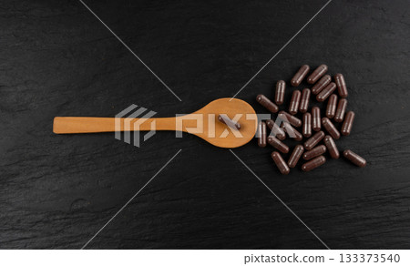 Iron capsule, Fe pills, dark red hemoglobin supplement tablets, vitamin capsules, mineral 133373540