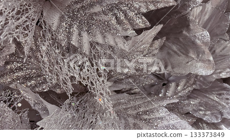 Abstract macro of silver glittery mesh fabric. Frozen lace Christmas decoration texture background 133373849