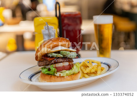 Avocado burger, fries and beer set Avocado burger, fries and beer set 133374052