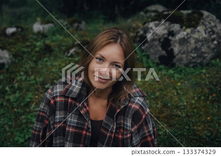 gentlehaired woman relaxing on verdant stone surrounded by rural tranquility and simplicity gentlehaired woman relaxing on verdant stone surrounded by rural tranquility and simplicity 133374329