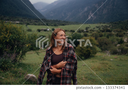hopeful female hiker amidst panoramic scenery, panoramic valley scene with reflective adventurous hopeful female hiker amidst panoramic scenery, panoramic valley scene with reflective adventurous 133374341