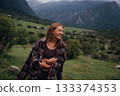 happy pregnant woman enjoying nature, pregnant caucasian woman in alpine landscape exuding maternal 133374353