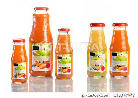 Juice in a glass bottle, bright colored drink on a white background isolated Juice in a glass bottle, bright colored drink on a white background isolated 133377448