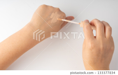 Foundation cream smear isolated. Cosmetic concealer textured swatch, skin tone cream 133377834