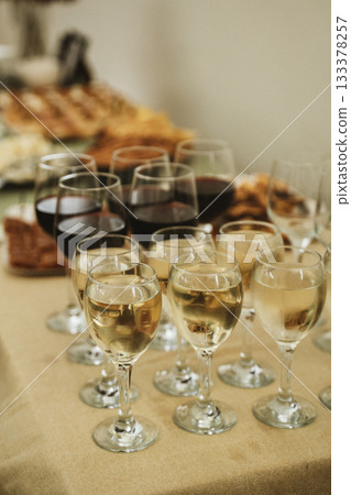 Glasses of Red and White Wine on Buffet Table 133378257