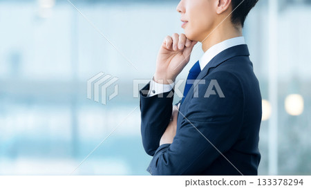 A male businessman thinking A male businessman thinking 133378294