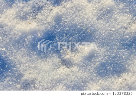 Texture of the white snow. Winter background 133378325