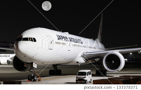JAL735J retired aircraft taxiing on a moonlit night 133378371
