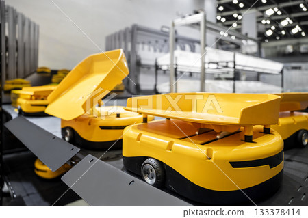 Automatic warehouse robot car carries cardboard box assembly in factory. Automatic warehouse robot car carries cardboard box assembly in factory. 133378414