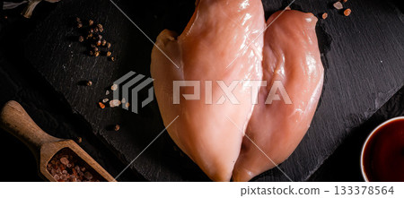 raw chicken fillet on stone background with copy space for your text 133378564