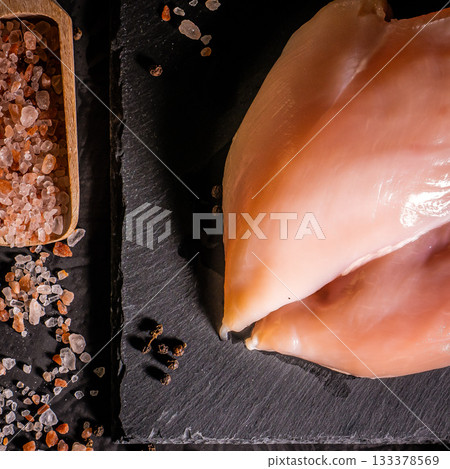 Fresh raw chicken breast fillet, organic meat. Black background. Top view Fresh raw chicken breast fillet, organic meat. Black background. Top view 133378569