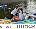 SUP yoga, two girls 133379106