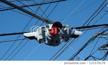 Electric power lines and red traffic lights in Japan Electric power lines and red traffic lights in Japan 133379170
