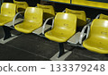 Yellow plastic chairs in the subway in Japan 133379248