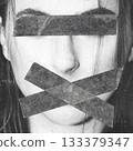 Abstract woman portrait with eyes and mouth covered with duct tape 133379347