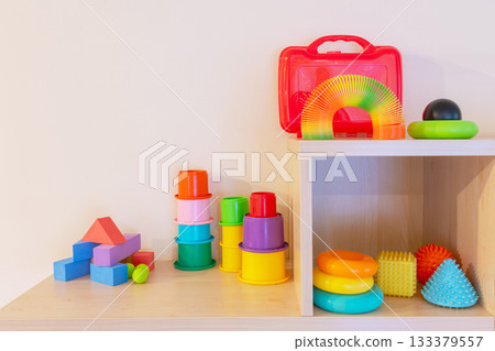 Various colorful children toys on shelf Various colorful children toys on shelf 133379557