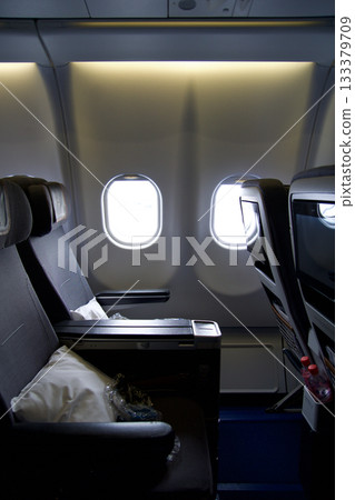 Frankfurt, Germany, June 10, 2019: Seat Pitch in Premium Economy on a Long Haul Flight Frankfurt, Germany, June 10, 2019: Seat Pitch in Premium Economy on a Long Haul Flight 133379709