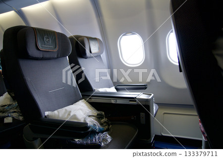 Frankfurt, Germany, June 10, 2019: Premium Economy Seats by the Window on a Long Haul Aircraft Frankfurt, Germany, June 10, 2019: Premium Economy Seats by the Window on a Long Haul Aircraft 133379711