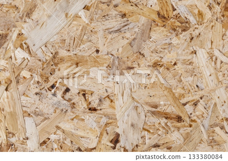 Textured surface of oriented strand board material 133380084
