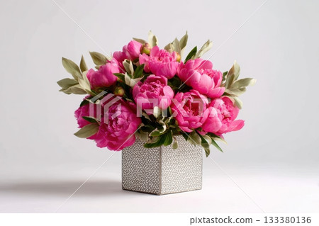 Bright pink peonies in a decorative silver box 133380136