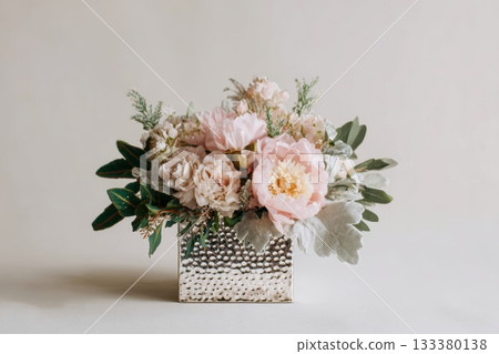 Beautiful floral arrangement in silver vase Beautiful floral arrangement in silver vase 133380138