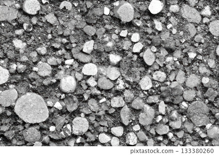 Textured surface of gravel and stones in black and white 133380260