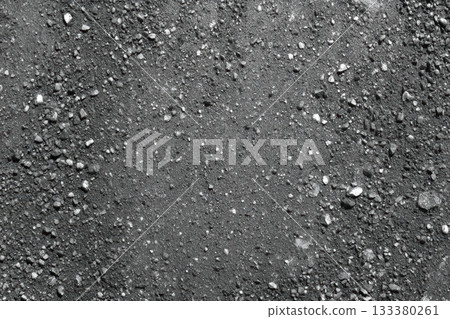 Black and white ground texture with small rocks 133380261
