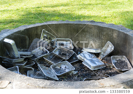 Many Disposable Grills, Used Grill Piles, Barbecue Garbage with Foil Pans, Human Waste Many Disposable Grills, Used Grill Piles, Barbecue Garbage with Foil Pans, Human Waste 133380559