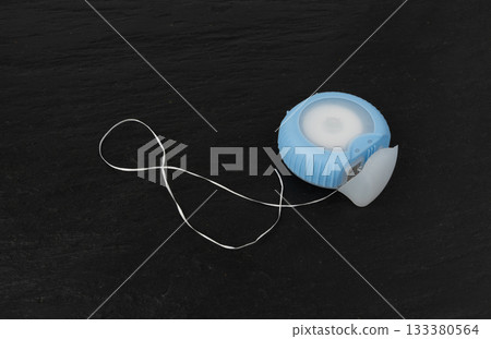 Dental floss plastic container top view. Tooth care string, oral healthcare floss packaging Dental floss plastic container top view. Tooth care string, oral healthcare floss packaging 133380564
