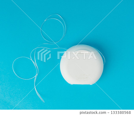 Dental floss plastic container top view. Tooth care string, oral healthcare floss packaging Dental floss plastic container top view. Tooth care string, oral healthcare floss packaging 133380568