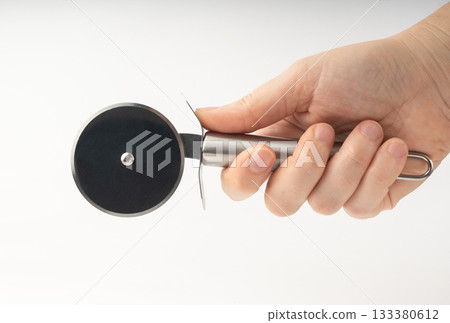 Pizza cutter isolated. Round roller knife with circle wheel, metal blade utensil 133380612