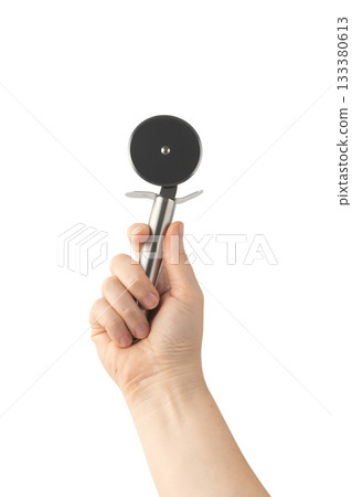 Pizza cutter isolated. Round roller knife with circle wheel, metal blade utensil Pizza cutter isolated. Round roller knife with circle wheel, metal blade utensil 133380613