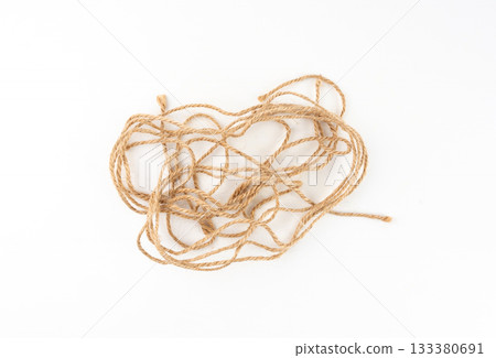 Twine rope piece isolated, jute loop fragment, beige packaging cord knots, old natural line cable Twine rope piece isolated, jute loop fragment, beige packaging cord knots, old natural line cable 133380691
