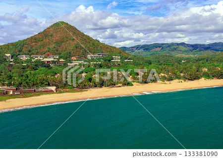 A picturesque view of the beach and mountain at Nianshan Park, Sanya, China. A picturesque view of the beach and mountain at Nianshan Park, Sanya, China. 133381090