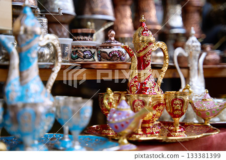 Traditional Bosnian handmade coffee sets on sale. Copper cezves, porcelain cups, and matching accessories. Bascarsija bazaar in Sarajevo. Traditional Bosnian handmade coffee sets on sale. Copper cezves, porcelain cups, and matching accessories. Bascarsija bazaar in Sarajevo. 133381399