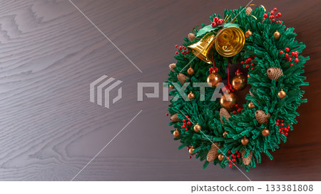 Christmas Wreath with Golden Bells on Wooden Background 3d render Christmas Wreath with Golden Bells on Wooden Background 3d render 133381808