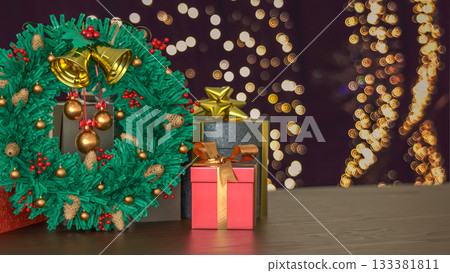 Christmas Wreath and Gift Boxes with Holiday Lights 3d render. 133381811