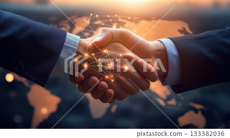Business handshake partnership collaboration agreement golden light sunset 133382036
