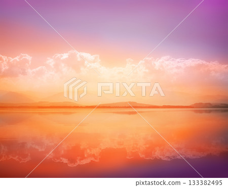 Sunset waterscape of lake with sky reflection Sunset waterscape of lake with sky reflection 133382495