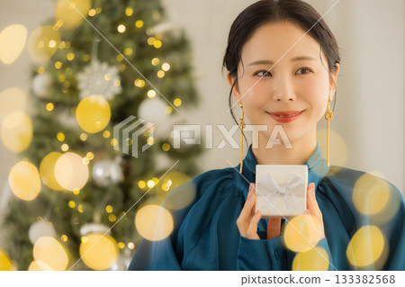 A young lady with a present A young lady with a present 133382568