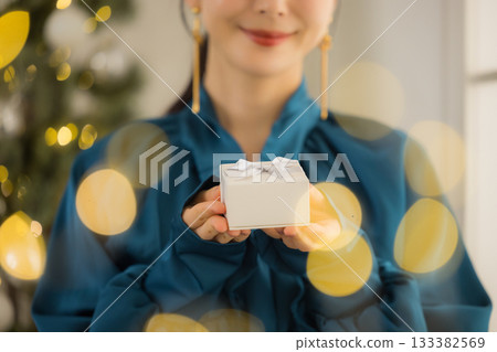 A young lady with a present 133382569