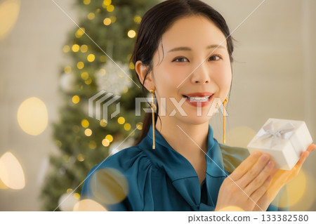 A young lady with a present 133382580