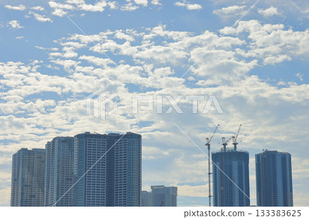 High-rise apartment buildings spread out against the blue sky High-rise apartment buildings spread out against the blue sky 133383625
