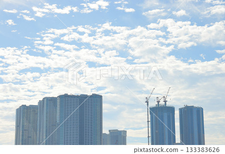 High-rise apartment buildings spread out against the blue sky High-rise apartment buildings spread out against the blue sky 133383626