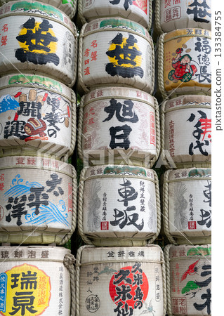 Stacked decorative Japanese sake barrels at a shrine in Tokyo, Japan 133384755