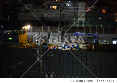 Late-night track maintenance in the city Late-night track maintenance in the city 133385384