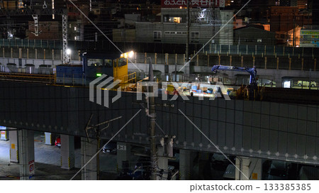 Late-night track maintenance in the city 133385385