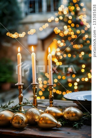 Golden Christmas Candles Ornaments with Festive Lights create a magical holiday atmosphere 133385838