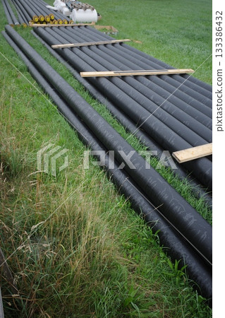Industrial Pipes on Green Grass Industrial Pipes on Green Grass 133386432